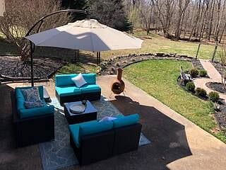Your Reserved Patio Area with seating and umbrella