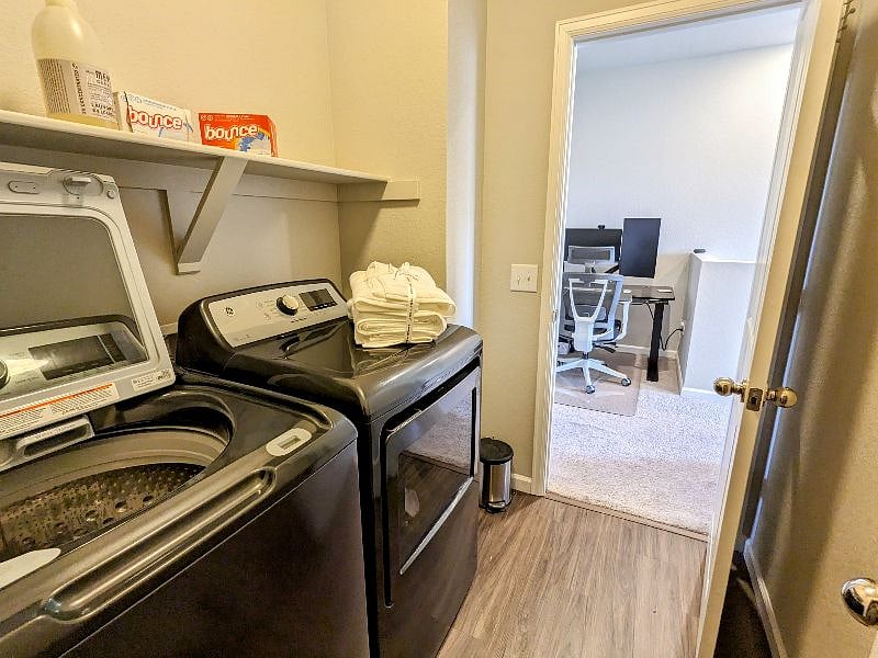Laundry room with new washer and dryer