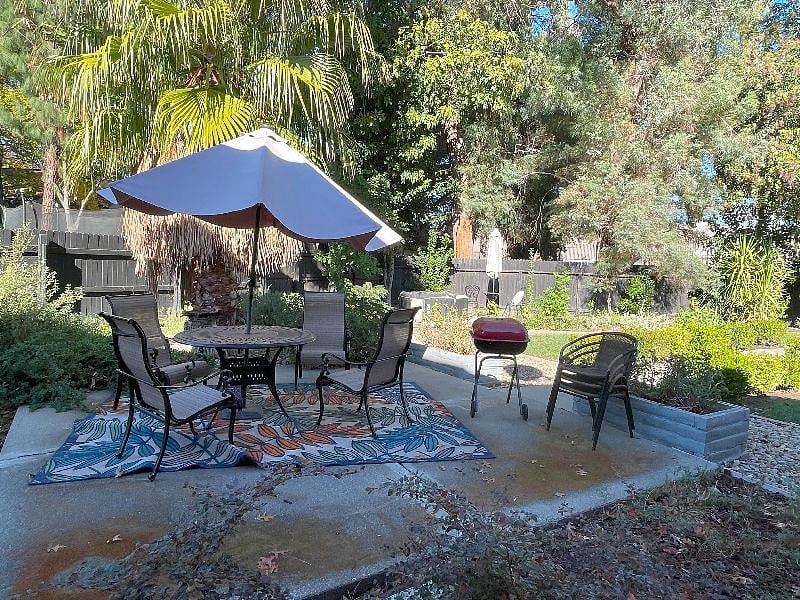 Table and chairs with umbrella