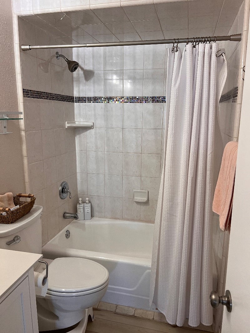 One of two bathrooms. The other not pictured has walk in tiled shower.
