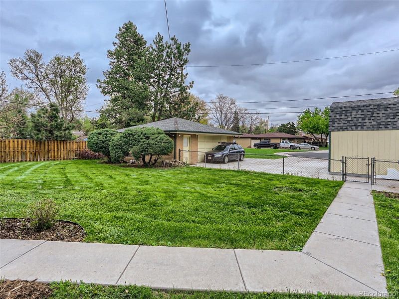 Large fenced-in grass-filled backyard for friends to gather and play yard games and sit around the fire (fire pit was installed this winter after taking the picture). The yard is completely fenced in so it's a great space for pets.