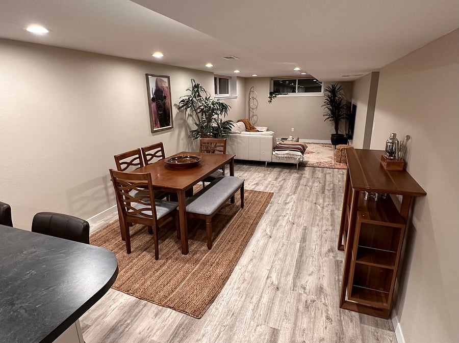 Dining room with fully stocked bar cart and table for six.