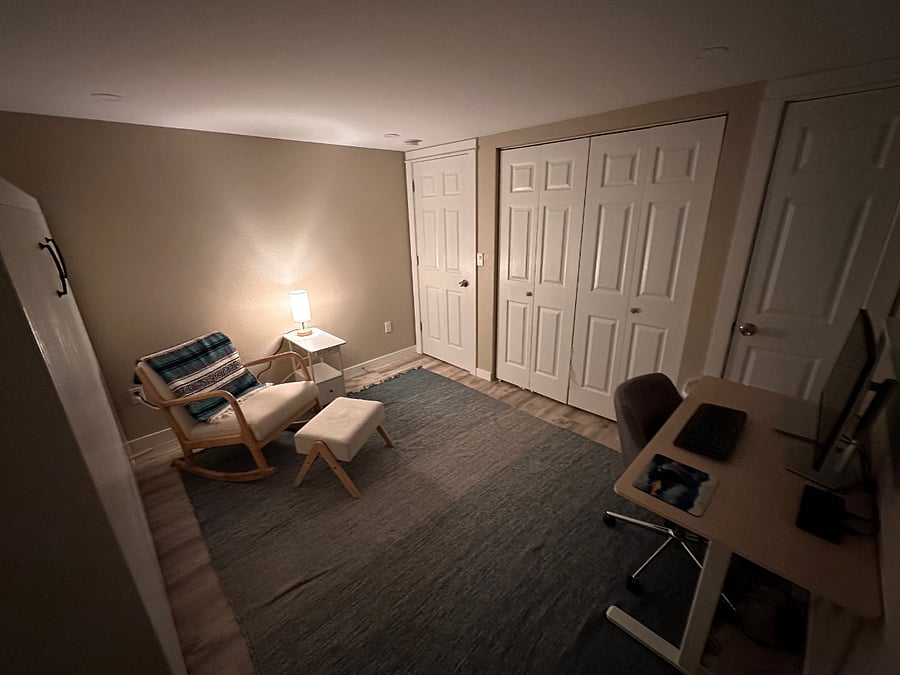 Evening view with bedside/chairside lamp on for evening reading.