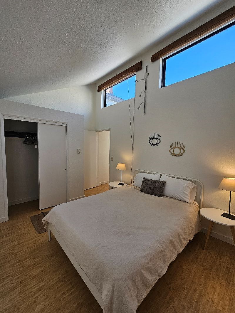 High, vaulted ceiling with lots of light when you want it, and blackout shades on every bedroom window when you don't.