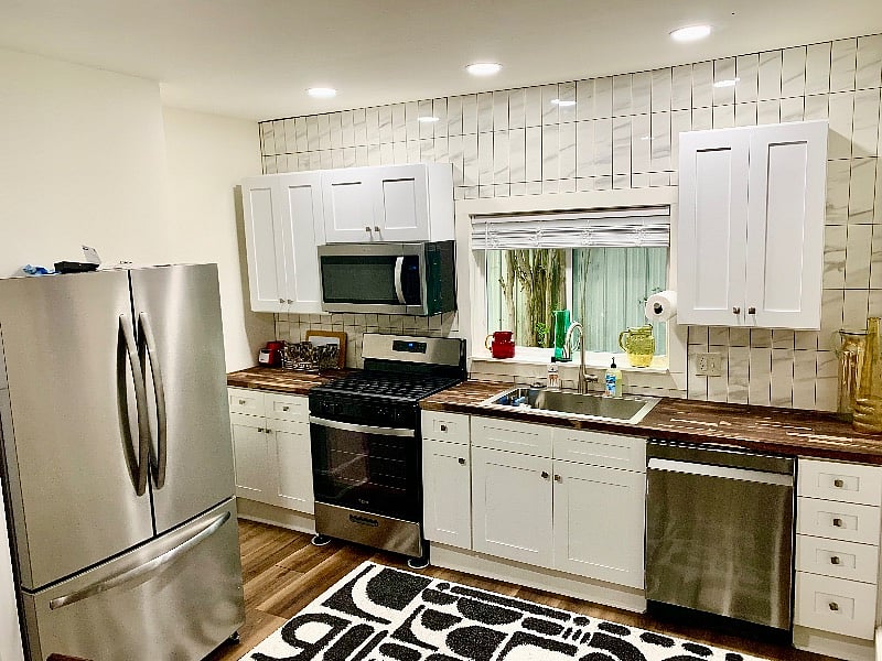 All New Kitchen Cabinets, Countertops, Appliances, Etc. Stone Tile backsplash to the Ceiling