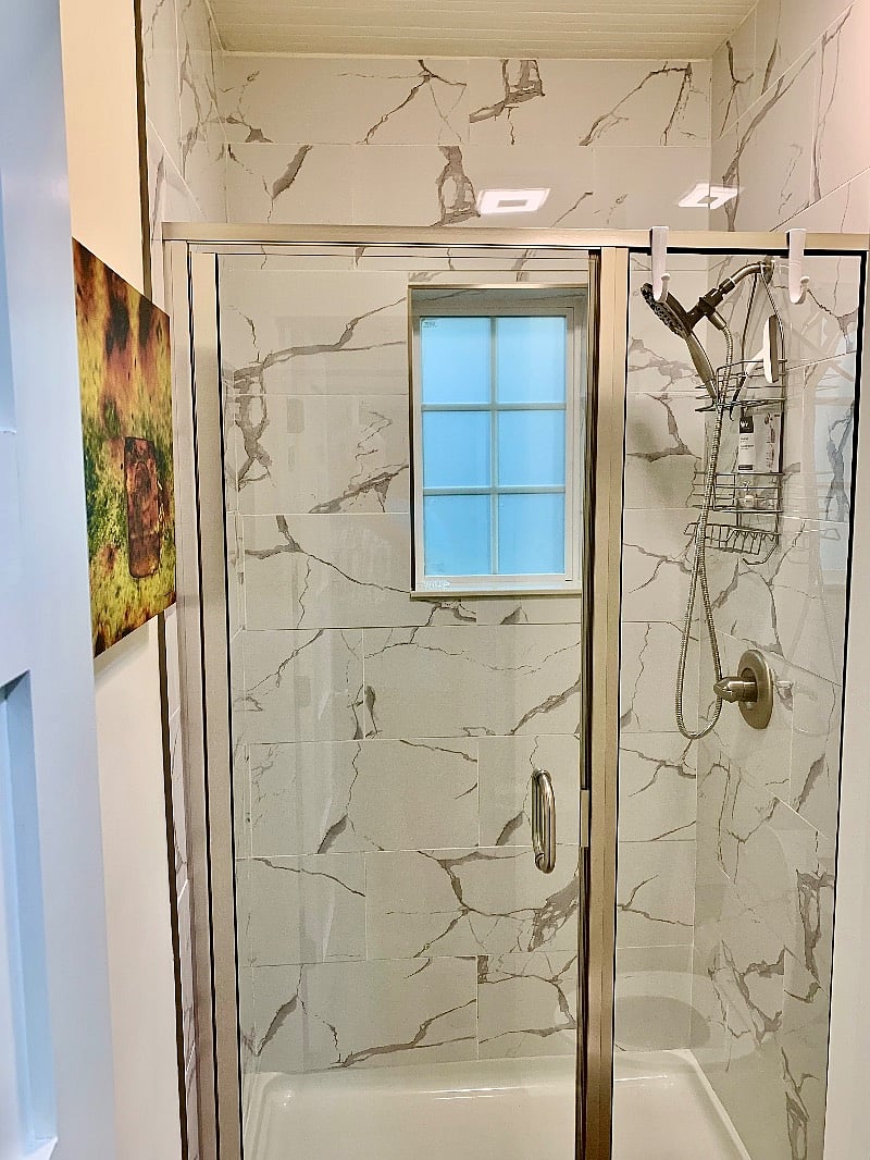 Oversized Shower with Bluetooth Speaker in the exhaust fan to enjoy.  New Frosted Window for privacy.
