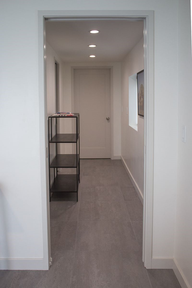 Additional storage area in extra wide hallway.