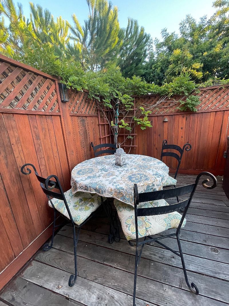 Outdoor dining area on back deck next to the jacuzzi.