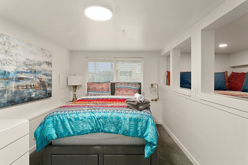 3rd bed. Downstairs with its own living area. Queen bed