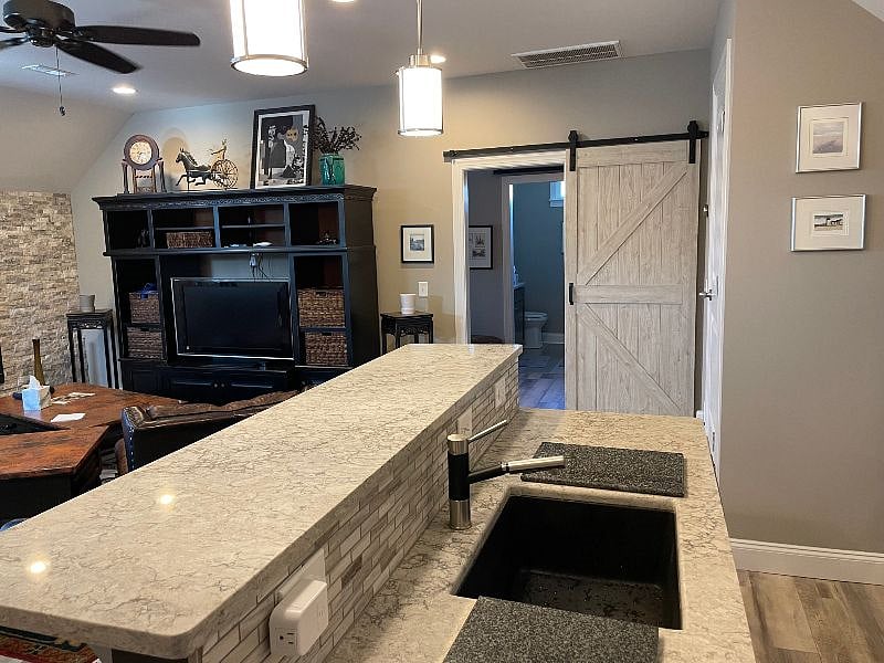 view from den into bedroom and bathroom