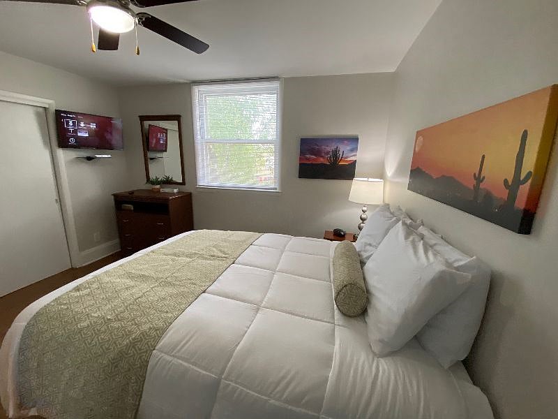 Bedroom 2 with the Ultimate Sleep Experience. New Double Plush Queen Beds with Extra Lumber Support, Crisp New Bedding and Comfort Sleep Pillows.