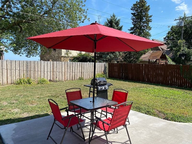 Enjoy the beautiful outdoors complete with patio furniture and grill.
