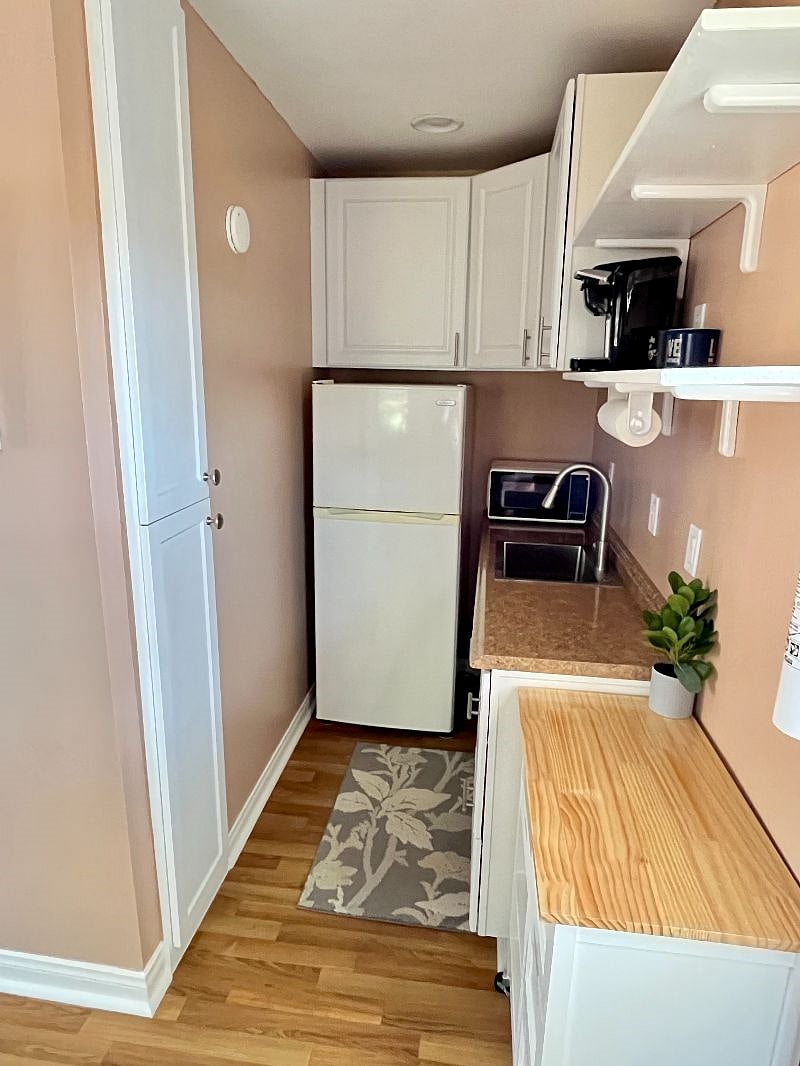Tall Cabinet with Ironing board and Iron, Full Fridge, Microwave, New Wave Induction Cooktop, Keurig Coffee Maker