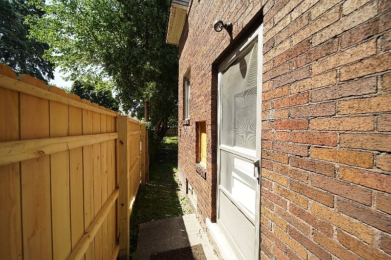 side entrance to fully fenced yard- just open the door and let the dog run free! 