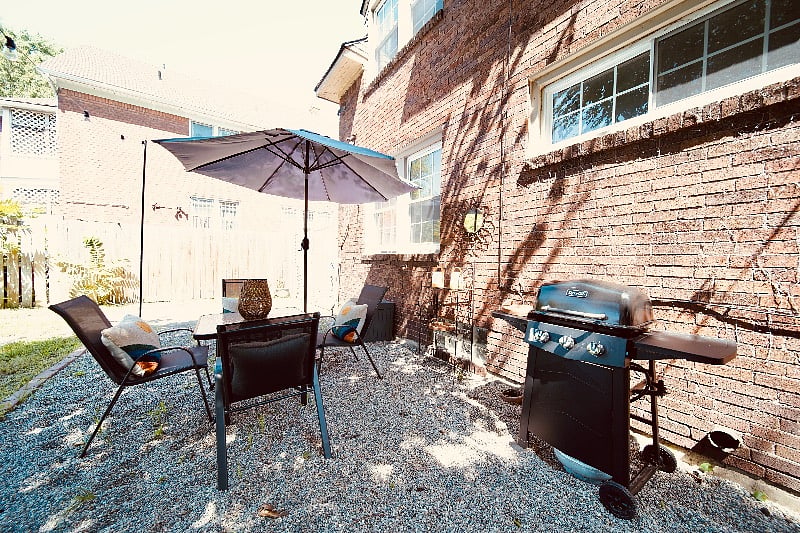 gas grill and patio set for outdoor dining 