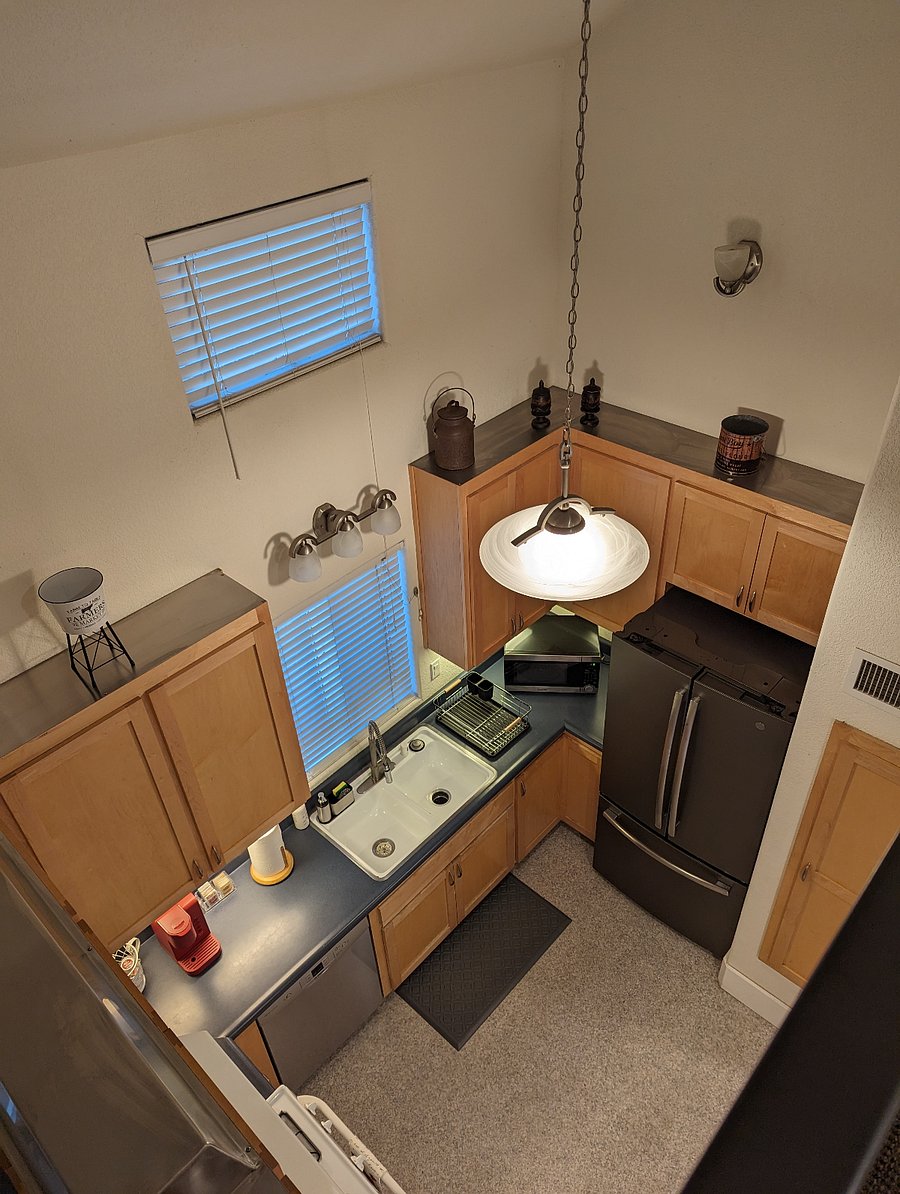 This angle is standing in the loft space next to the bedroom area, looking over the balcony.