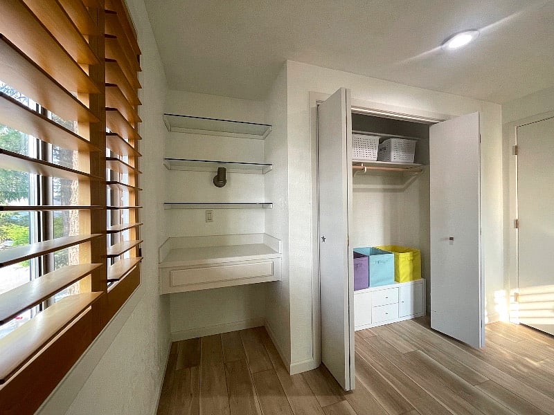 Bedroom 4 features a built-in desk and glass shelves.