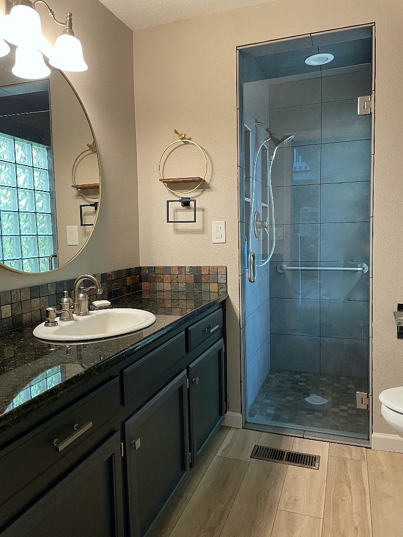 Guest Bathroom with beautiful tiled shower and glass block for lots of light. Located next to Bedroom 2.