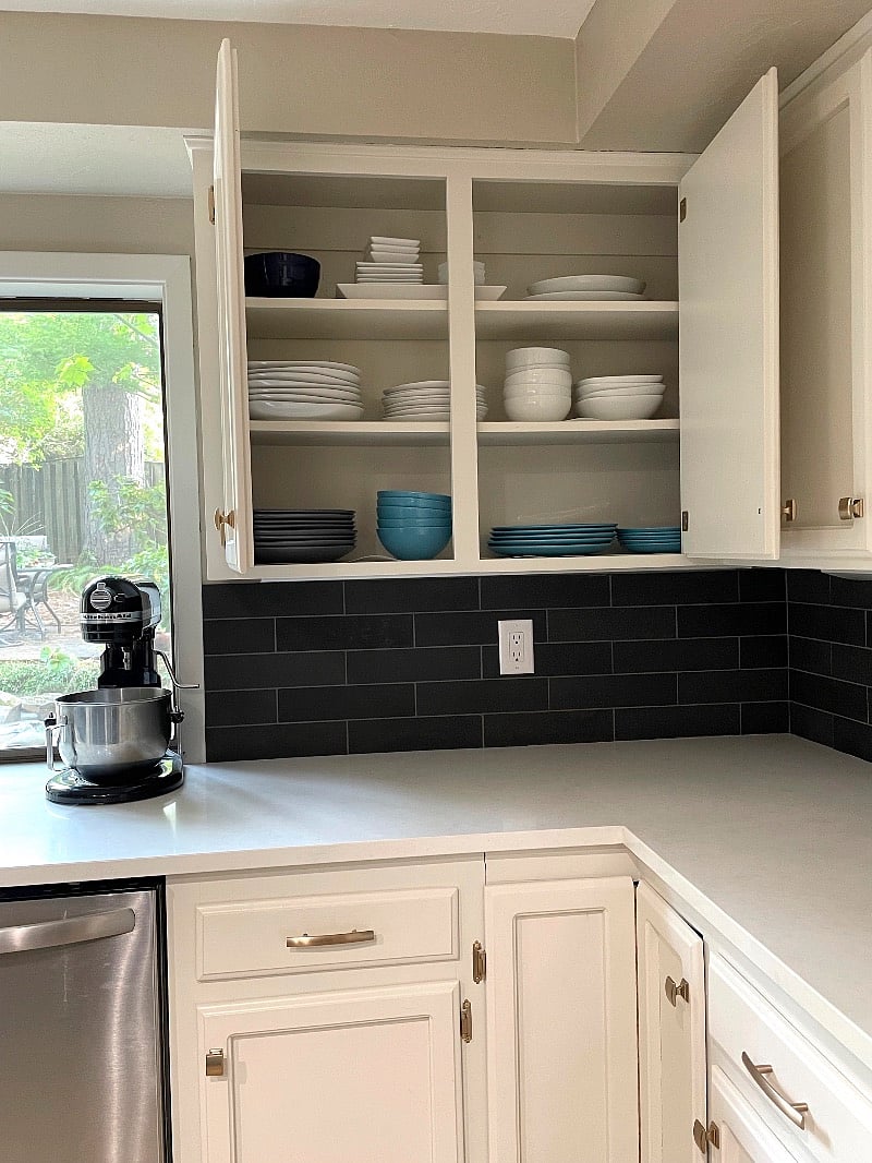 Fully furnished kitchen with dishes, cookware, utensils, SodaStream, Kitchenaid mixer, microwave, and large refrigerator.