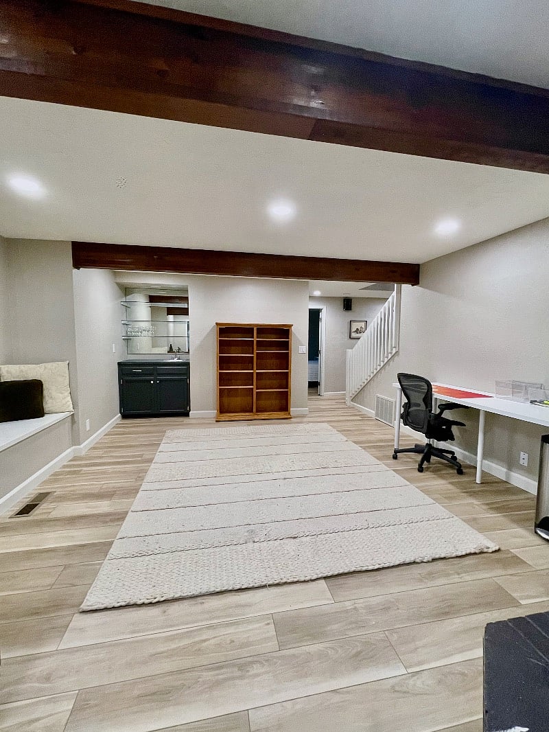 Family Room with desk, bar, and window seat.