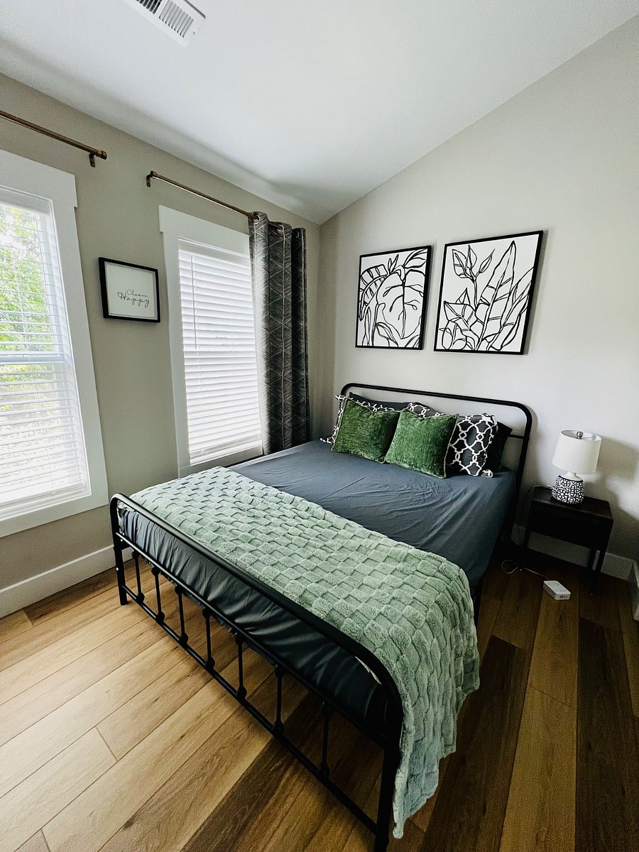 Bedroom 2 with a queen size bed and a desk
