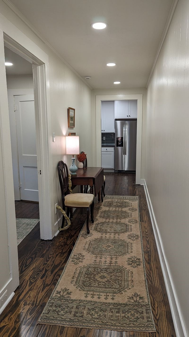Drop leaf (on castors) in wide hall makes for a great dining area when needed.