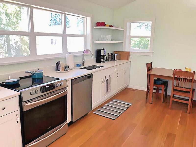 Spacious full-size kitchen with stove, fridge, dishwasher.
