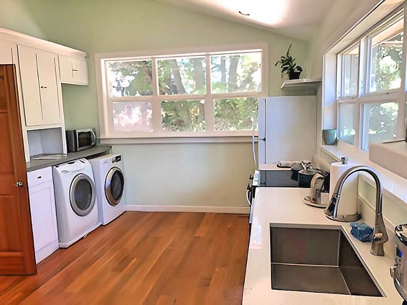 Washer and dryer unit in kitchen.