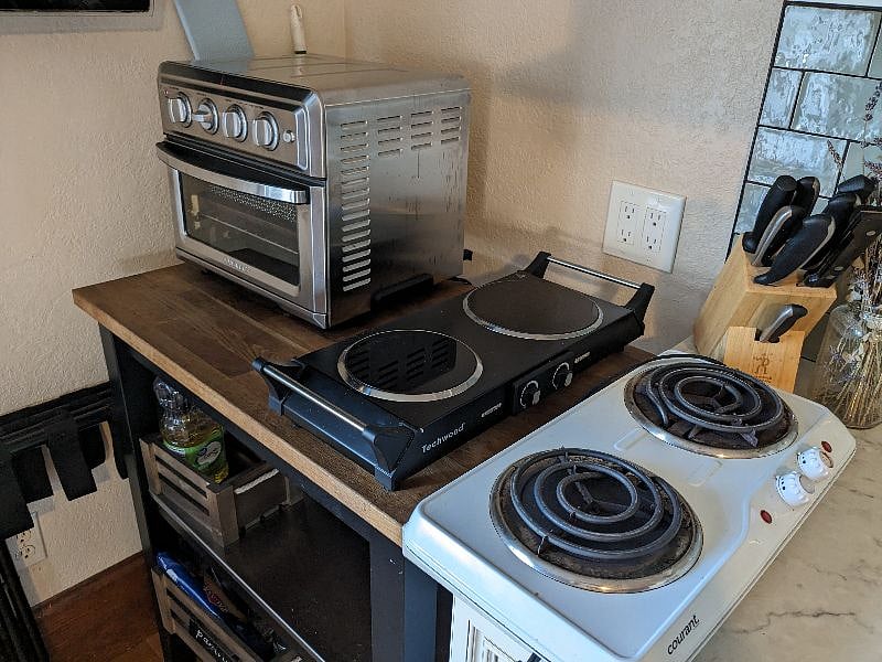 Two electric hotplates and a convection oven/toaster.