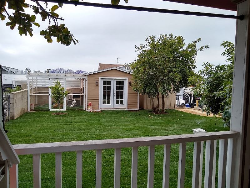 Your view of the backyard from your private back patio: chicken coup and meditation/storage room sheds. We have guava, persimmon, fig, apricot and avocado trees as well as a garden (on the other side of the house) and love to share our bounty!