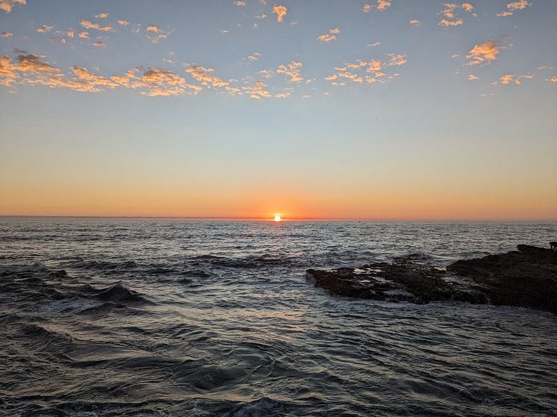 There's nothing like the sunsets in San Diego... over the ocean! There are gorgeous sunsets in the neighborhood overlooking a silhouetted downtown skyline and this photo was taken in Ocean Beach close to Sunset Cliffs (the twin coves at the end of Santa Cruz Avenue: 15 minutes drive).