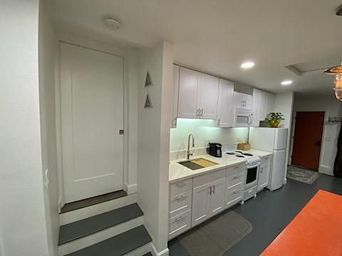 Bathroom door, two steps up to bathroom.