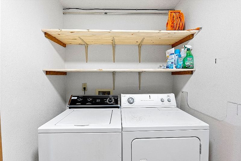 Dedicated washer and dryer downstairs; laundry line, iron and ironing board and vaccum