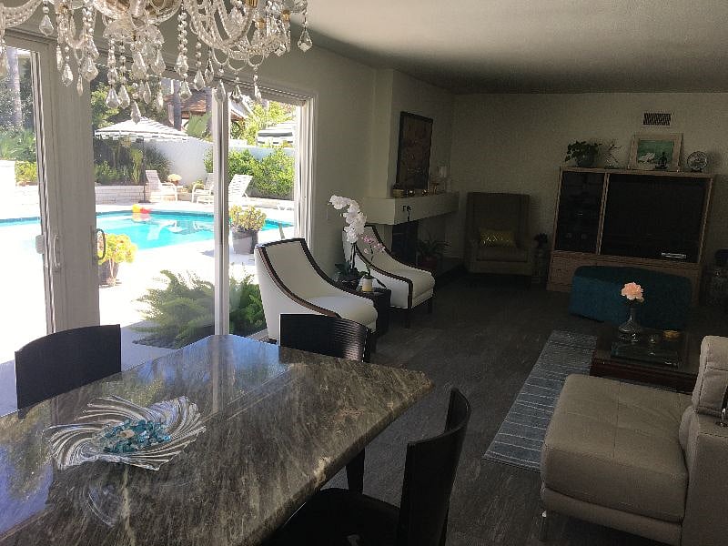 Living Room with Entertainment Center with record player, CD player, TV with streaming services