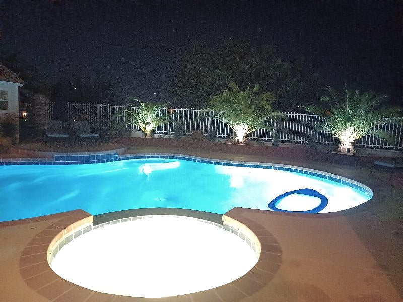 Night View of yard with pool lights