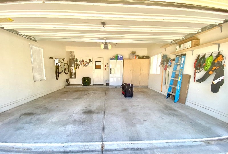 Large 2-Car Garage w/Smart App on overhead door motor, & 2nd fridge/freezer. Bike is not there now.