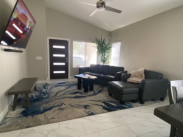 Family Room w/75-85" flat screen tv (I cannot remember if it's a 75" or an 85" but it's huge lol)