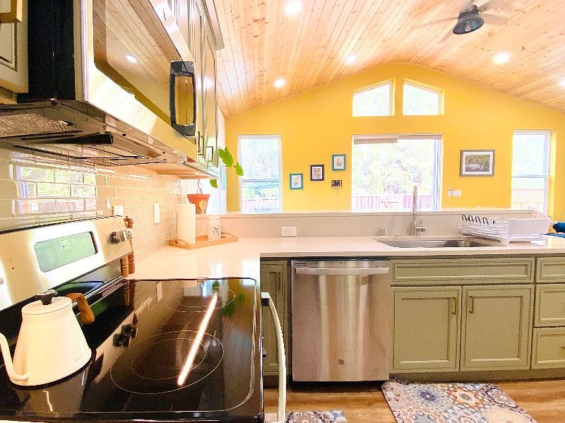 Looking out from the kitchen to the deck with an entire view of the living and dining space. 
Enjoy cooking while conversing with your loved ones.
