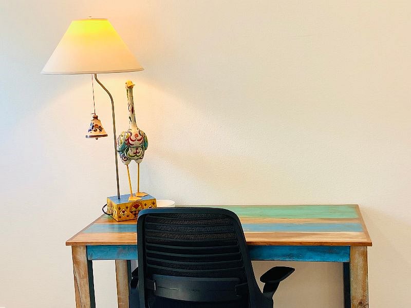 Dedicated workspace with an ergonomic chair. Surge protector extension cord provided with fast internet speeds?