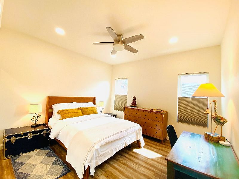 Snuggle in the comfort of Body Essential 11.5" firm mattress and pillows, remote controlled ceiling fan and touch based dimmable side lamps with usb charging ports. This bedroom includes large closet, dresser and a workspace with an ergonomic chair. 