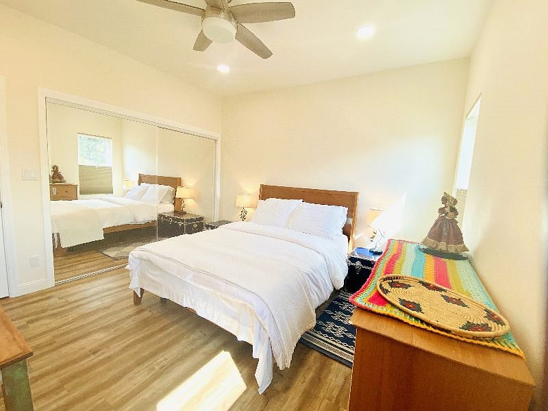 Snuggle in the comfort of Body Essential 11.5" firm mattress and pillows, remote controlled ceiling fan and touch based dimmable side lamps with usb charging ports. This bedroom includes large closet, dresser and a workspace with an ergonomic chair. 