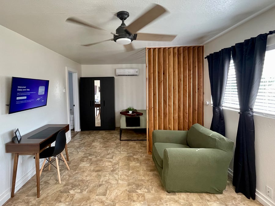 Cozy studio with room divider and mini split AC/Heater for added comfort.
