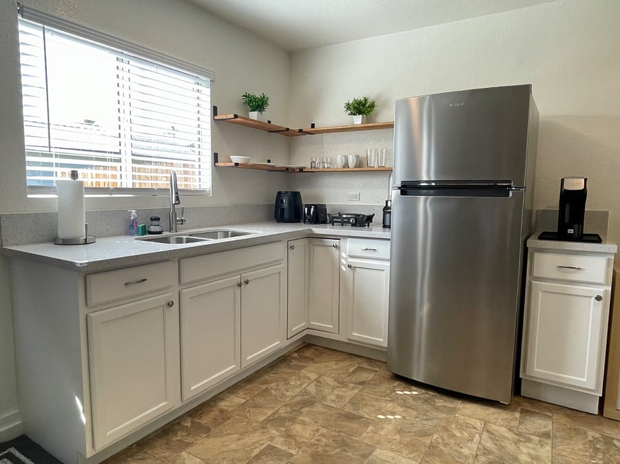 Spacious kitchenette with full size fridge, air fryer, hot plate, blender, toaster, coffee maker and microwave.
