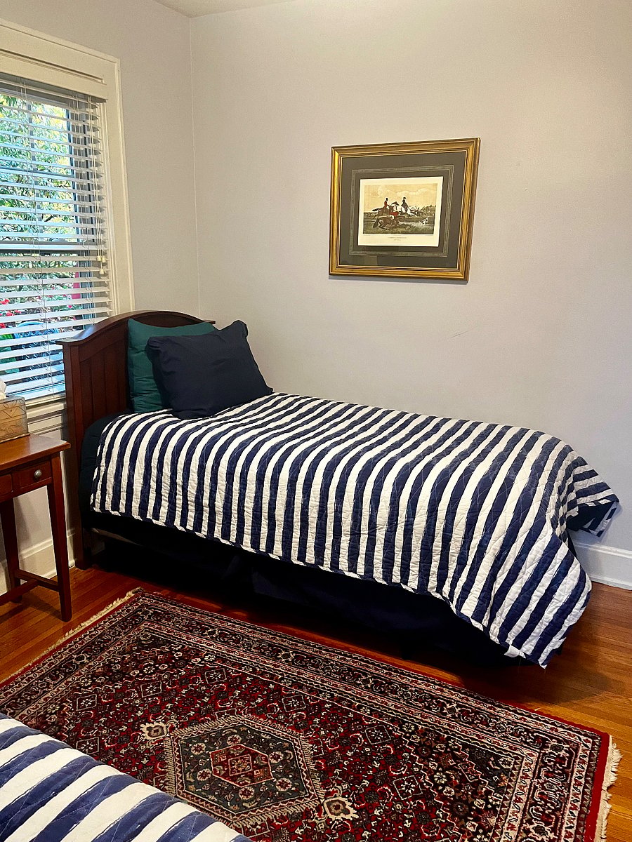 Recent updates to room with new Persian rug and paintings.
