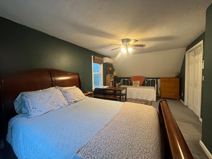 Bedroom 2 (Green Room) with designated work area.