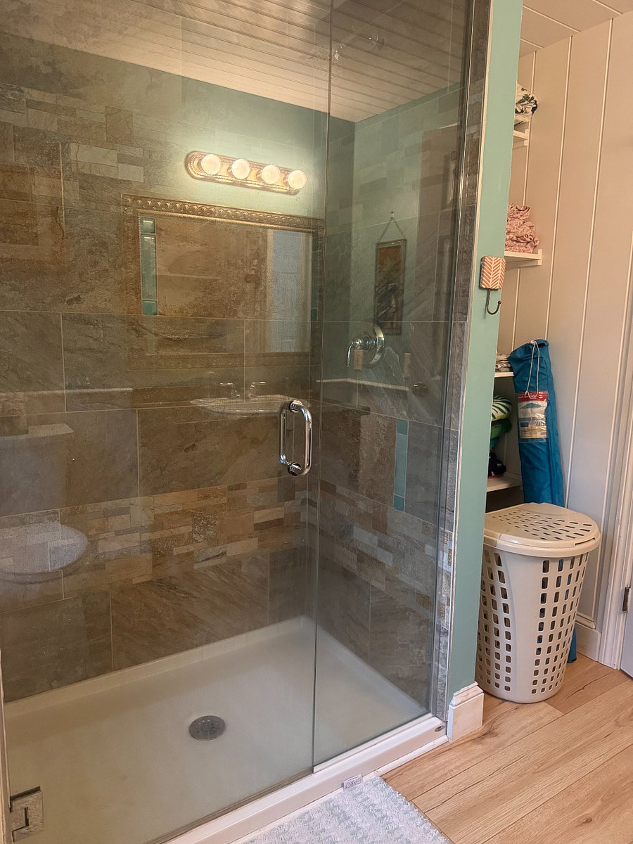 Newly renovated bathroom on second floor includes tiled shower