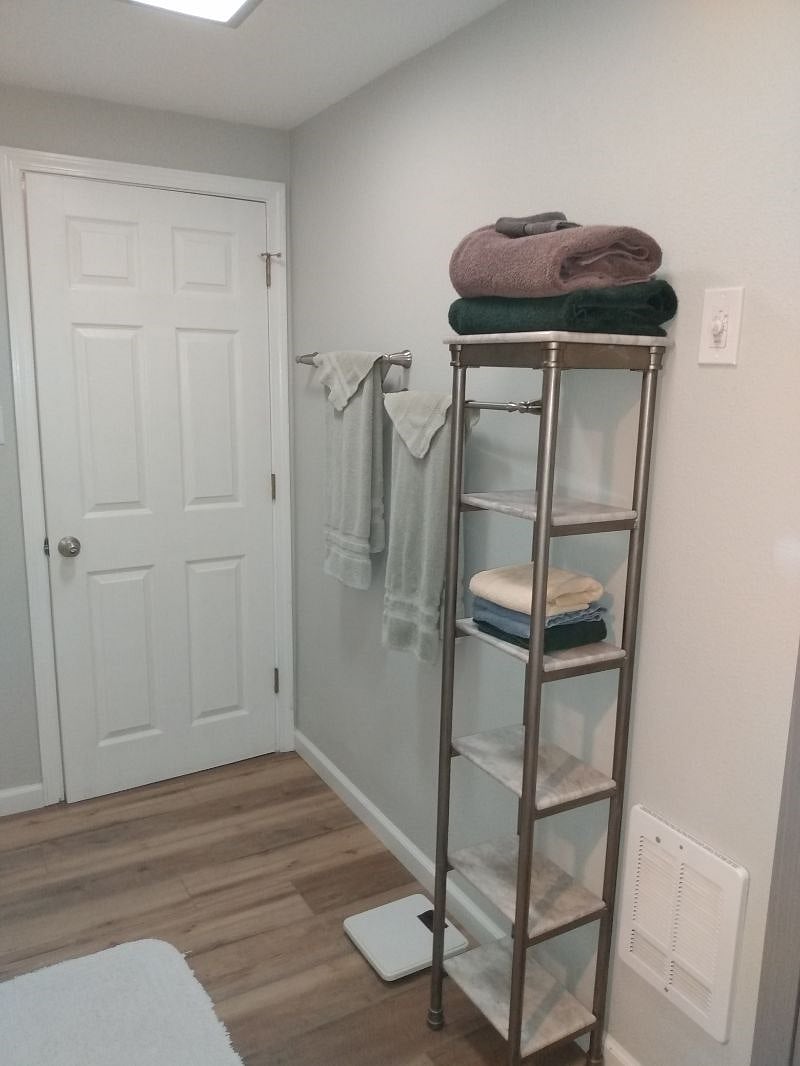 Bathroom with wall heater and plenty of storage