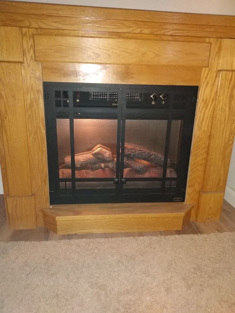 Den with electric fireplace