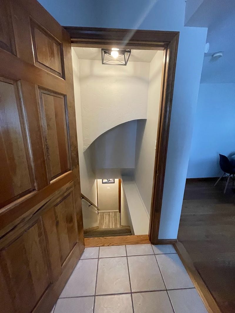 Stairs in the living room lead to the lower level