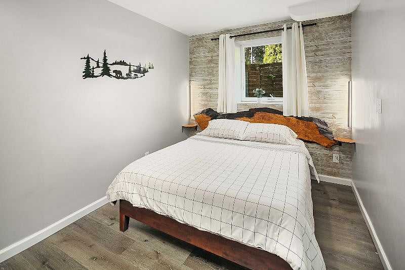 Bedroom #2 - Queen size Leesa Mattress

- 40" Samsung Smart TV (wall mounted)

- Electric fireplace

- A small closet

- Tastefully decorated with a live-edge maple headboard, floating pine bedside shelves and wall mounted reading lamps.